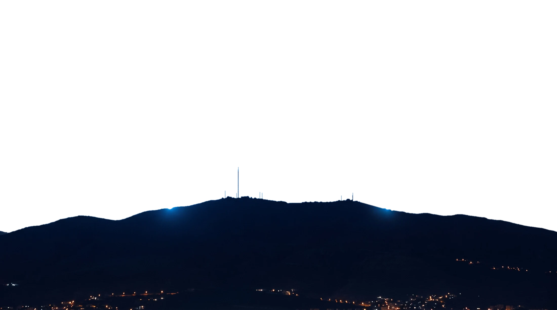 Mount Qasioun at night under a ring of blue light